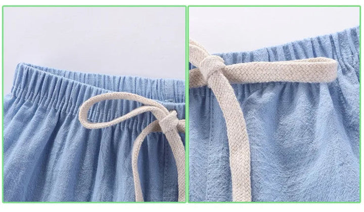 Close-up of a light blue shorts waistband with elastic gathers and a cream drawstring