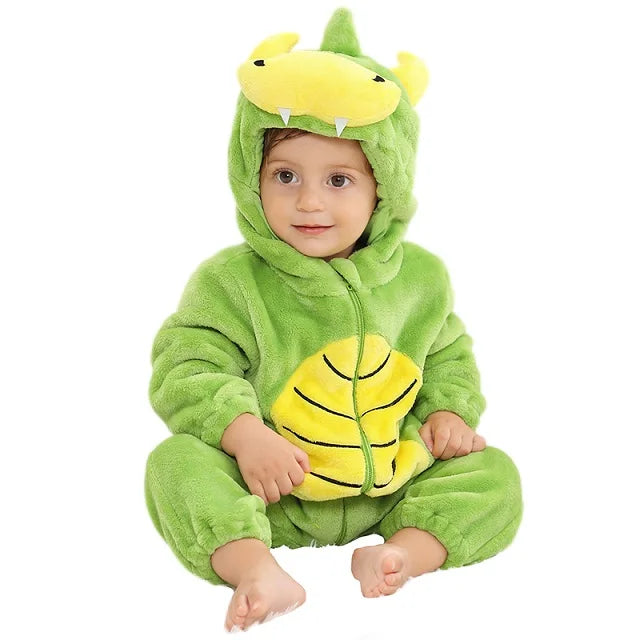 Baby in a light green crocodile romper with a yellow belly and tooth details on the hood.