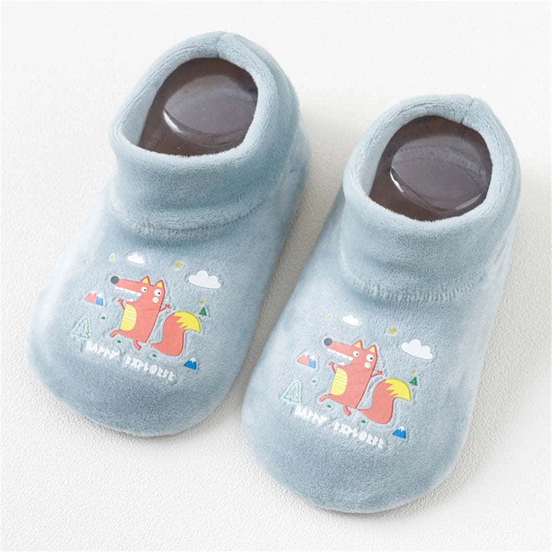 Light green sock shoes with fox prints and rounded toes
