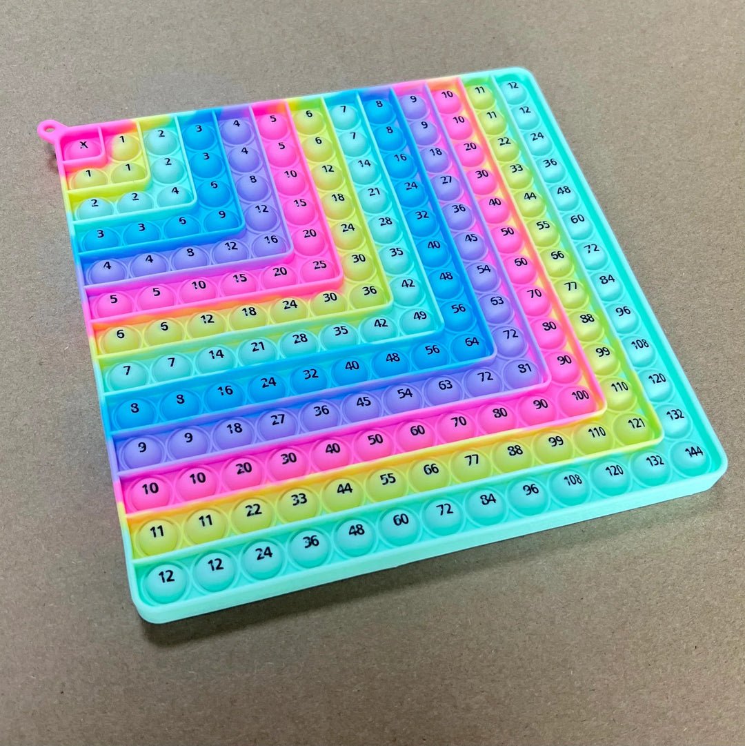 Angled view of the light rainbow math fidget board with a grid of numbered bubbles