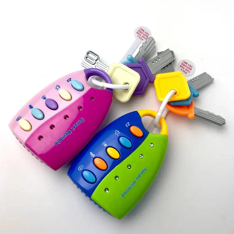 Blue-and-green and pink baby key toys, each with colorful buttons and a ring of toy keys
