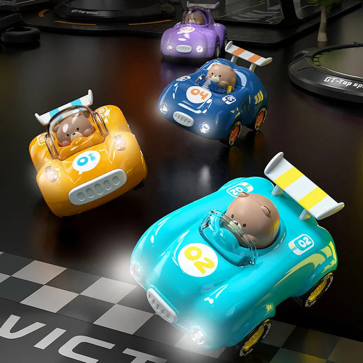 Colorful toy race cars with bear drivers and illuminated headlights on a tabletop race course