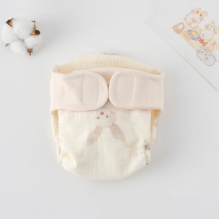 Cloth diaper with a pale long-eared rabbit illustration and cream waistband