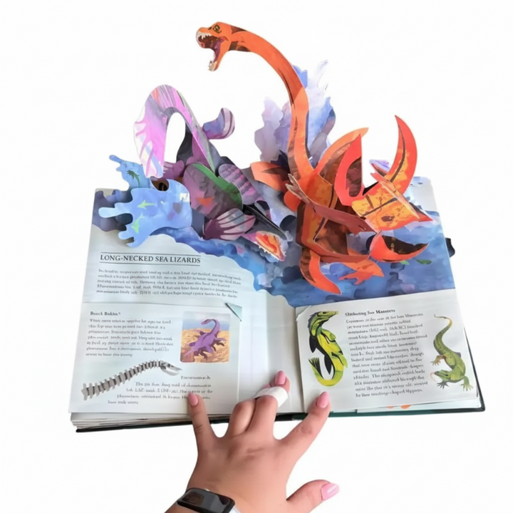 Sea monster pop-up scene with long-necked marine creatures, blue waves, and illustrated text panels