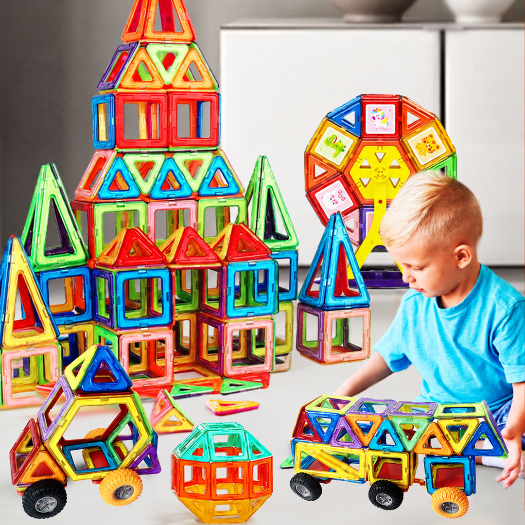 Child playing with magnetic buildings, a Ferris wheel model, and wheeled vehicles