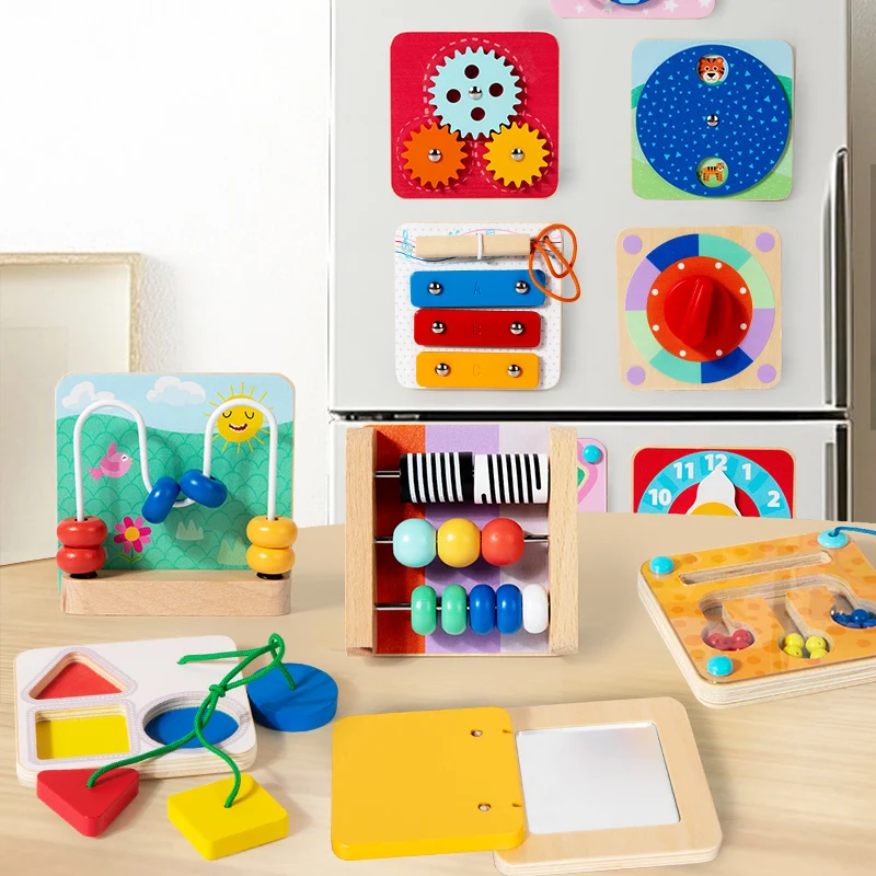 Magnetic activity boards on a refrigerator with bead mazes, shapes, and an open mirror board on a table.