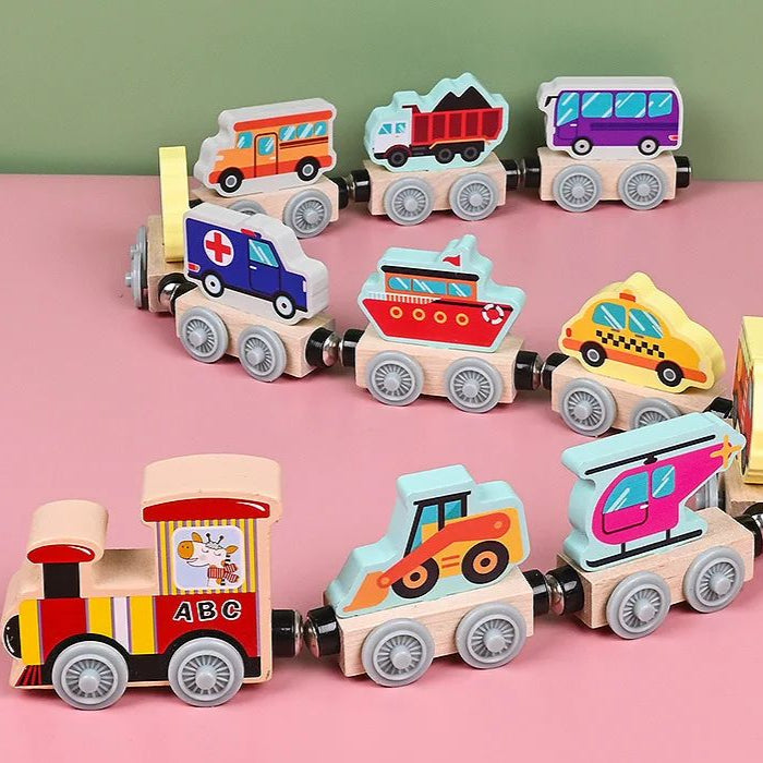 Wooden magnetic vehicle train with a red engine, construction vehicle, bus, and other transport cars