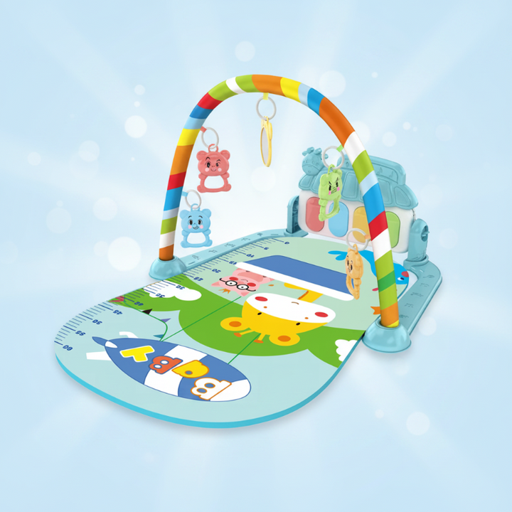 Mint baby play gym with a rocket-print mat and rainbow-striped arch