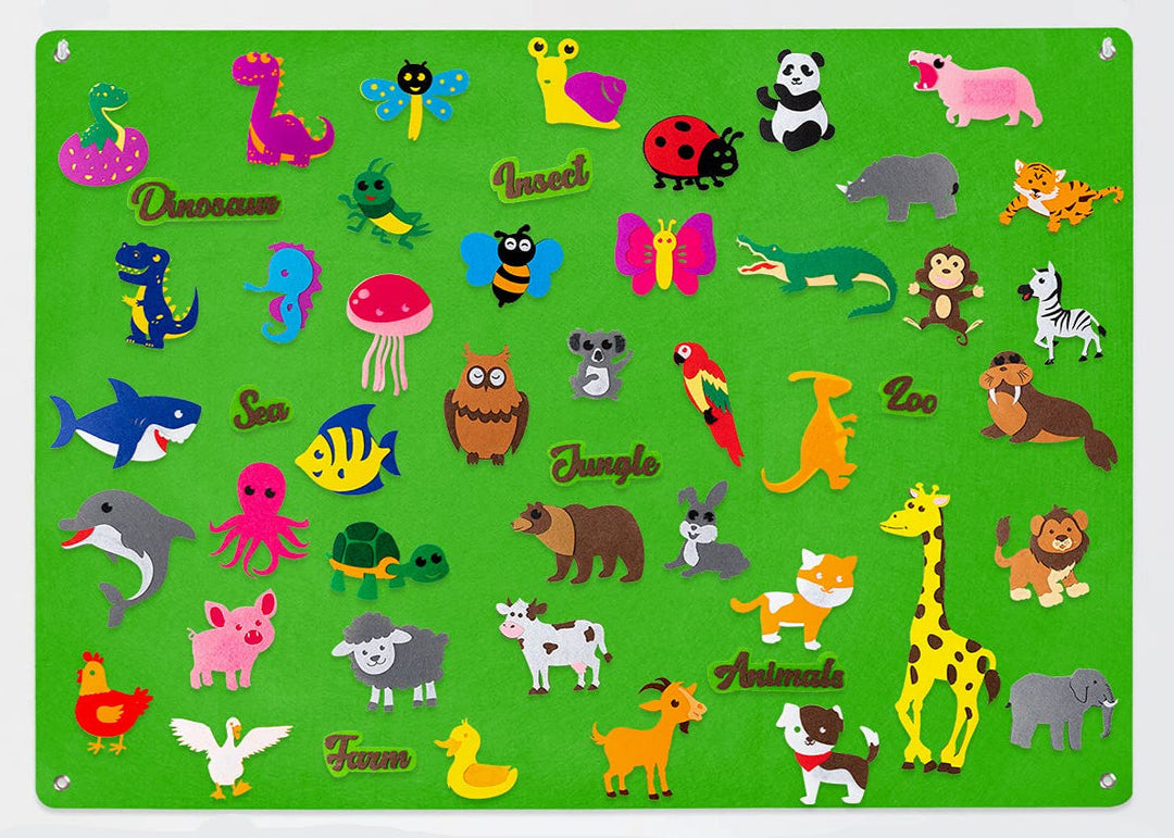 Green felt board filled with farm animals, sea creatures, insects, and dinosaurs