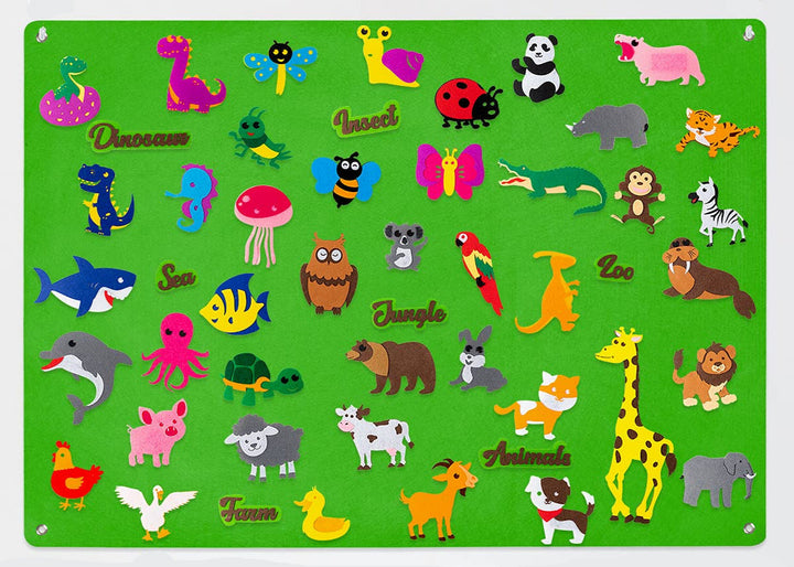 Green felt board filled with farm animals, sea creatures, insects, and dinosaurs