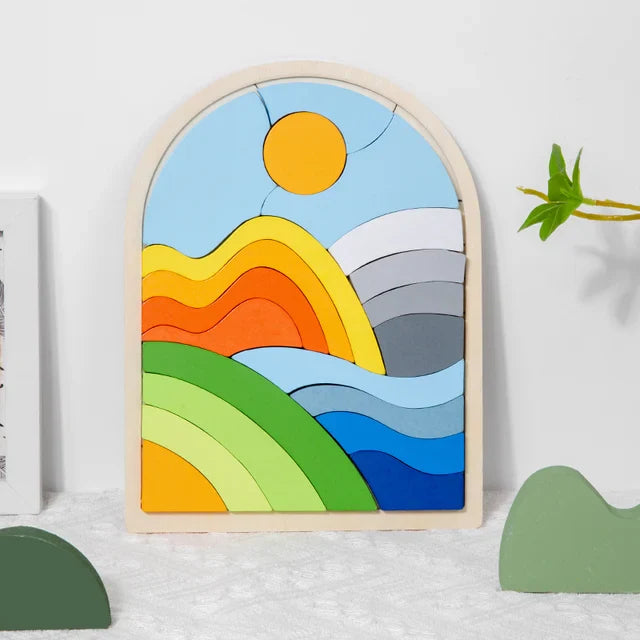 Mountain design wooden puzzle with a yellow sun, layered hills, and blue waves