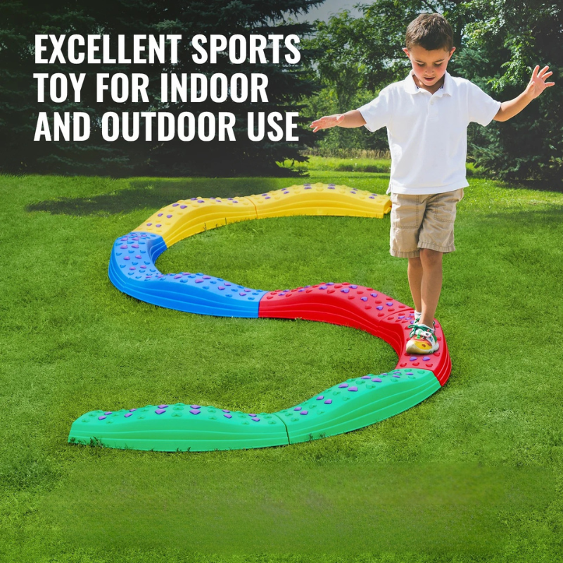 Child walking along a winding multicolor balance beam on a lawn