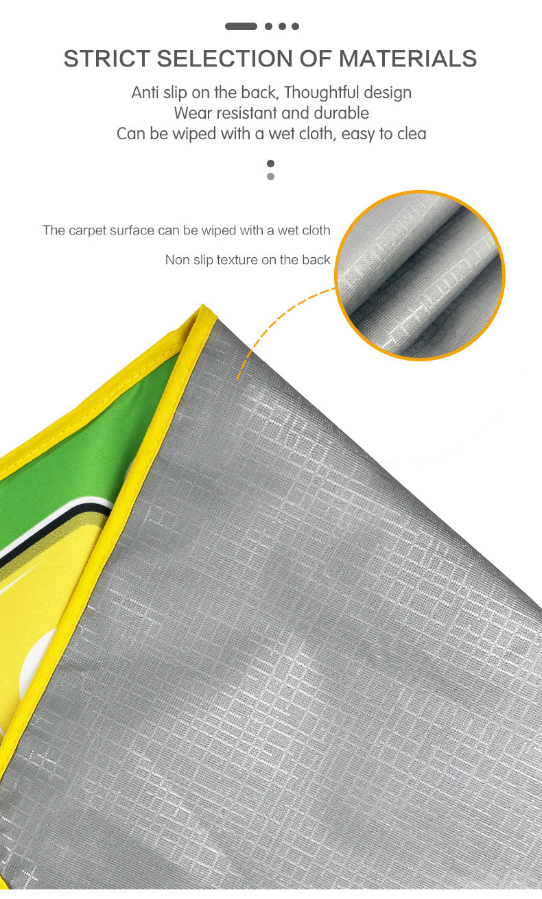 Corner of the musical play mat lifted to show its textured gray backing