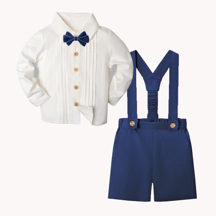 Navy suspender shorts beside a white long-sleeve shirt with a matching navy bow tie