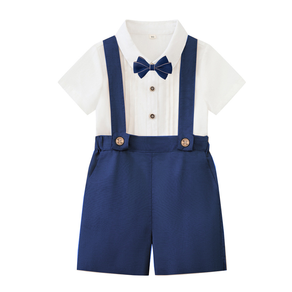 Navy suspender shorts paired with a white short-sleeve shirt and matching bow tie