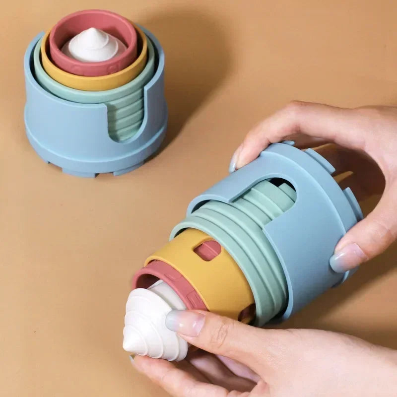 Pastel castle stacking pieces nested inside blue outer cups