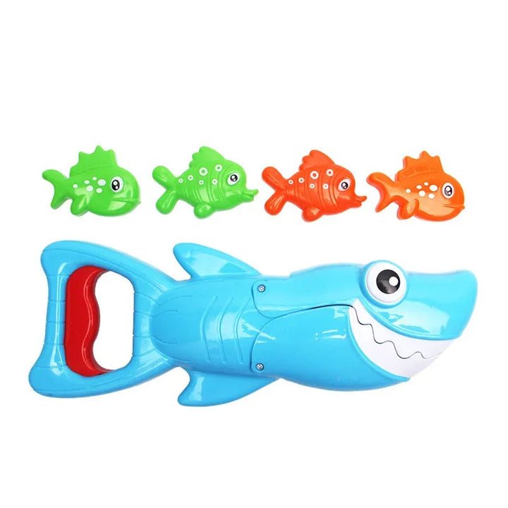 Blue shark bath toy with a red handle lever and four green and orange fish