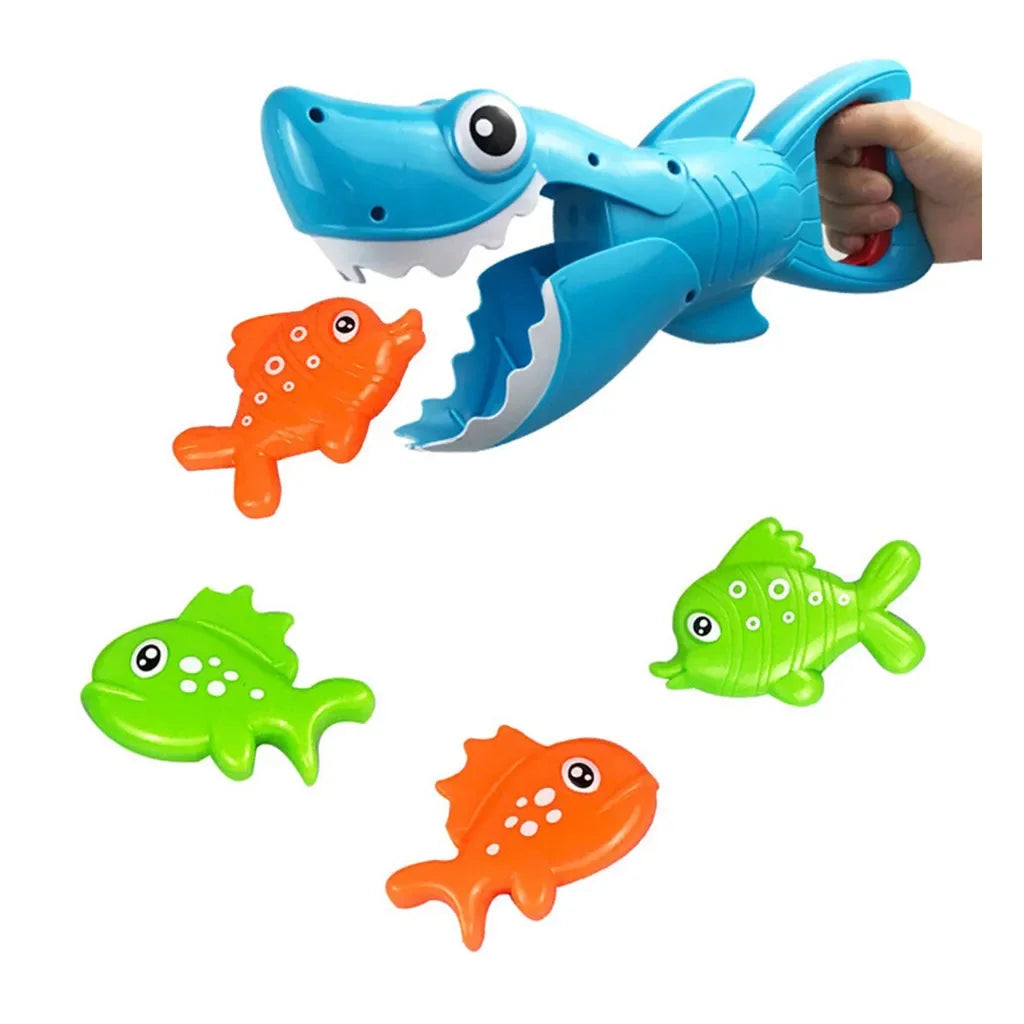 Handheld blue shark bath toy catching an orange fish, with three other fish nearby