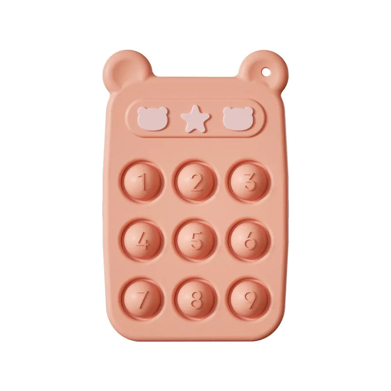 Orange silicone teething phone with nine numbered buttons and bear-ear corners