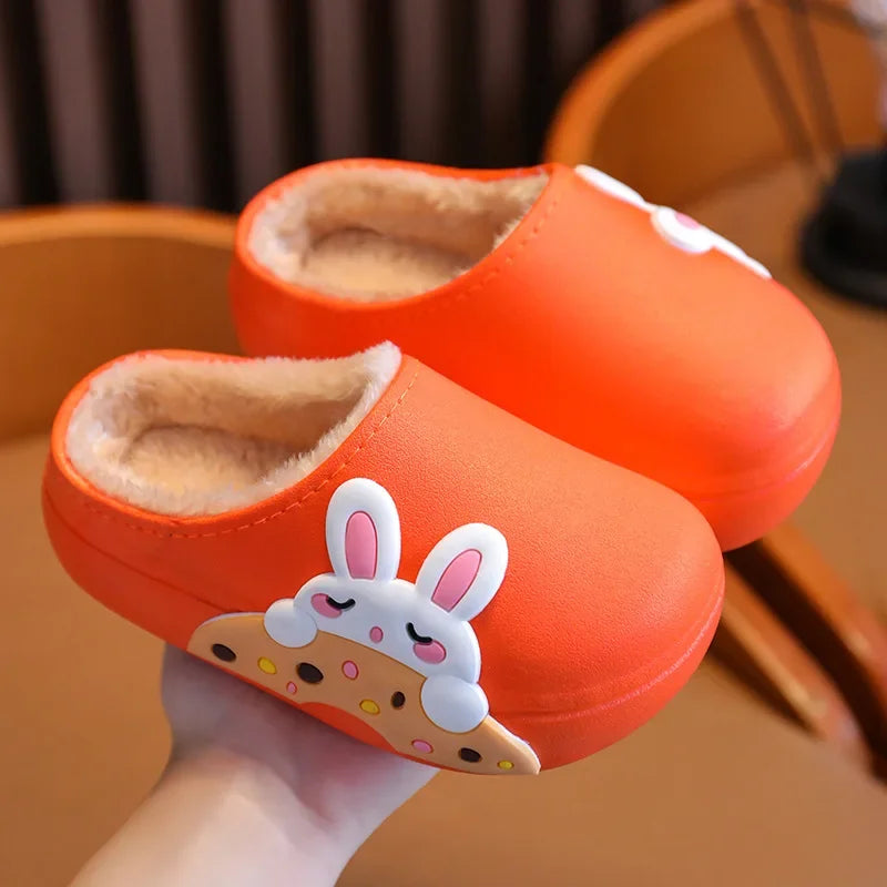 Orange bunny slippers with closed toes and beige fluffy lining