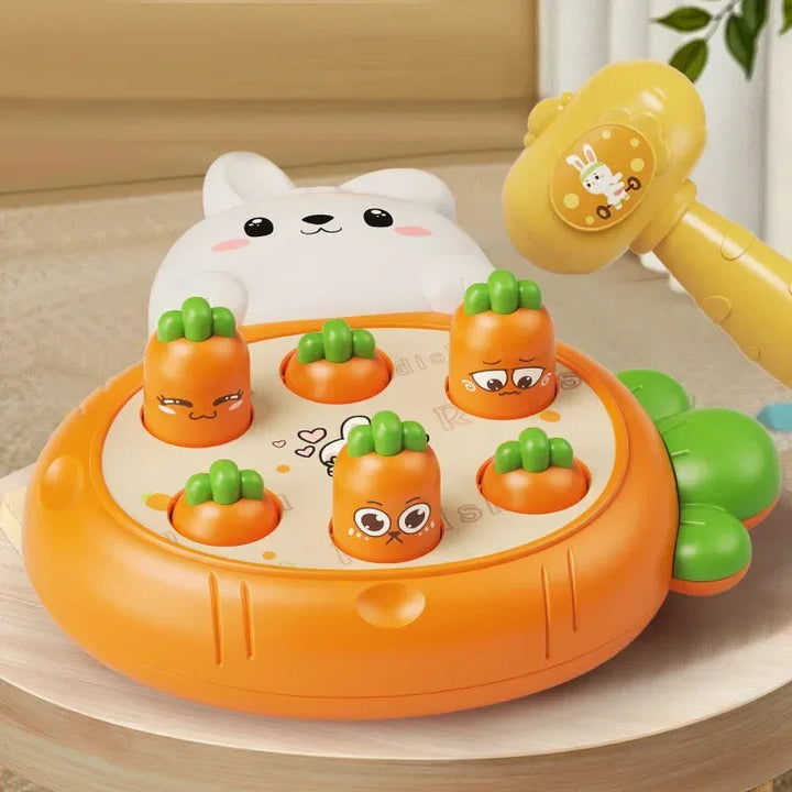 Orange carrot-target hammer toy with a white animal topper and yellow hammer