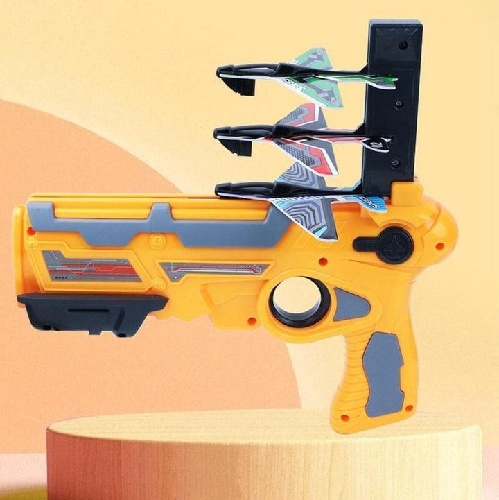 Orange airplane launcher with foam planes stacked in the loading rack