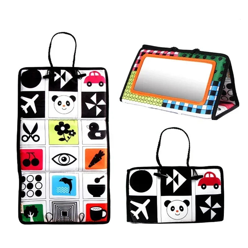 Orange-framed sensory mirror with black-and-white picture panels and colorful accents