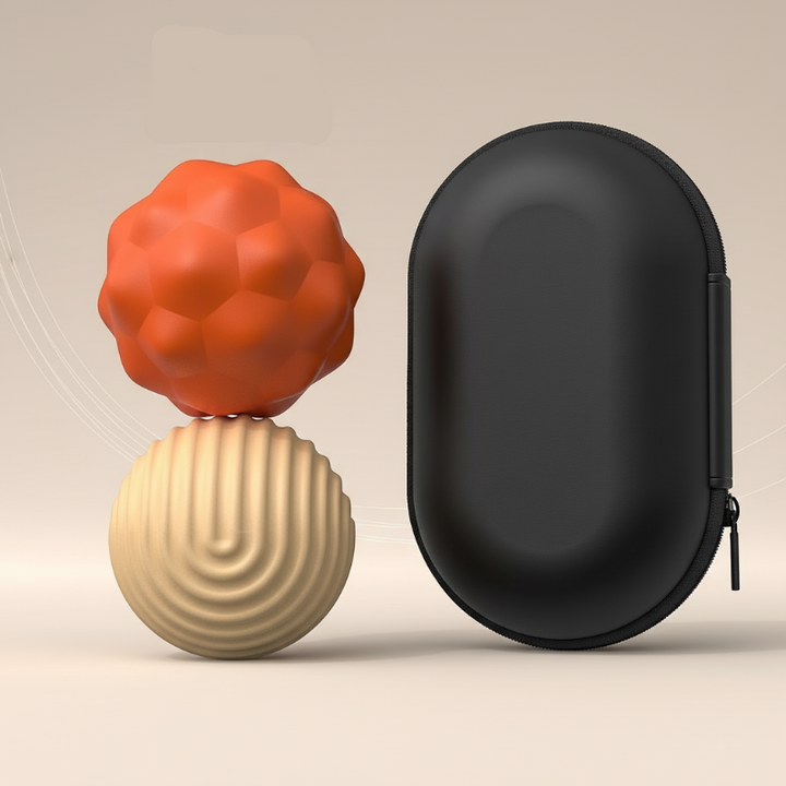 Two large orange and beige magnetic fidget beads beside a black zippered case
