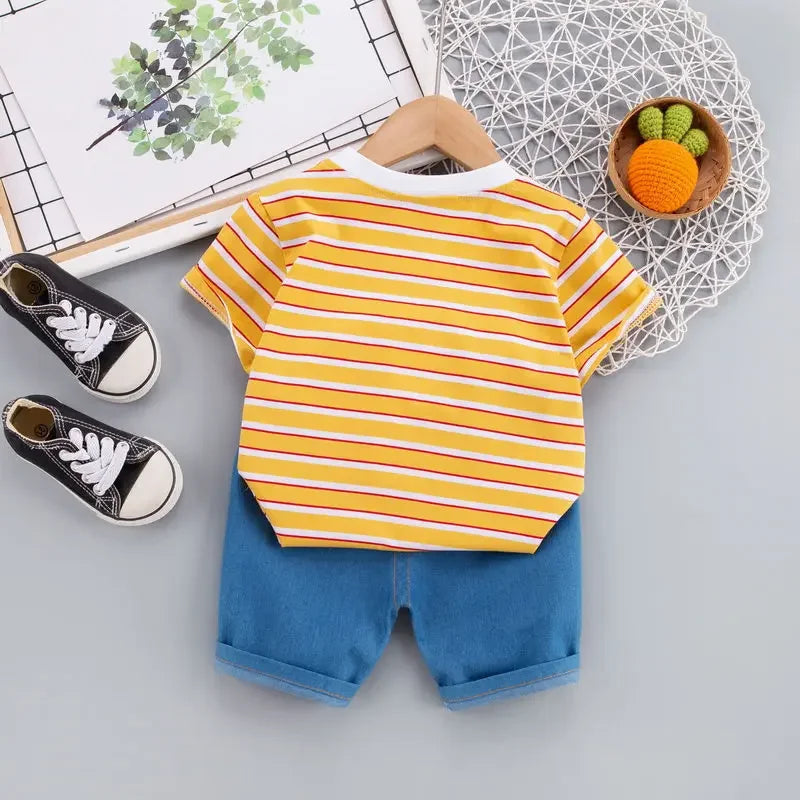 Back view of the orange striped T-shirt and blue shorts