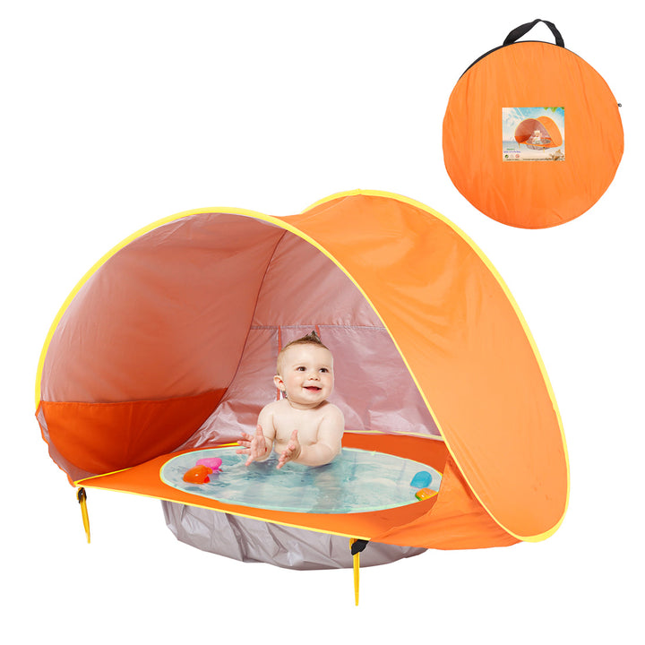 Orange pop-up tent with a baby in the built-in bath and a matching carrying bag
