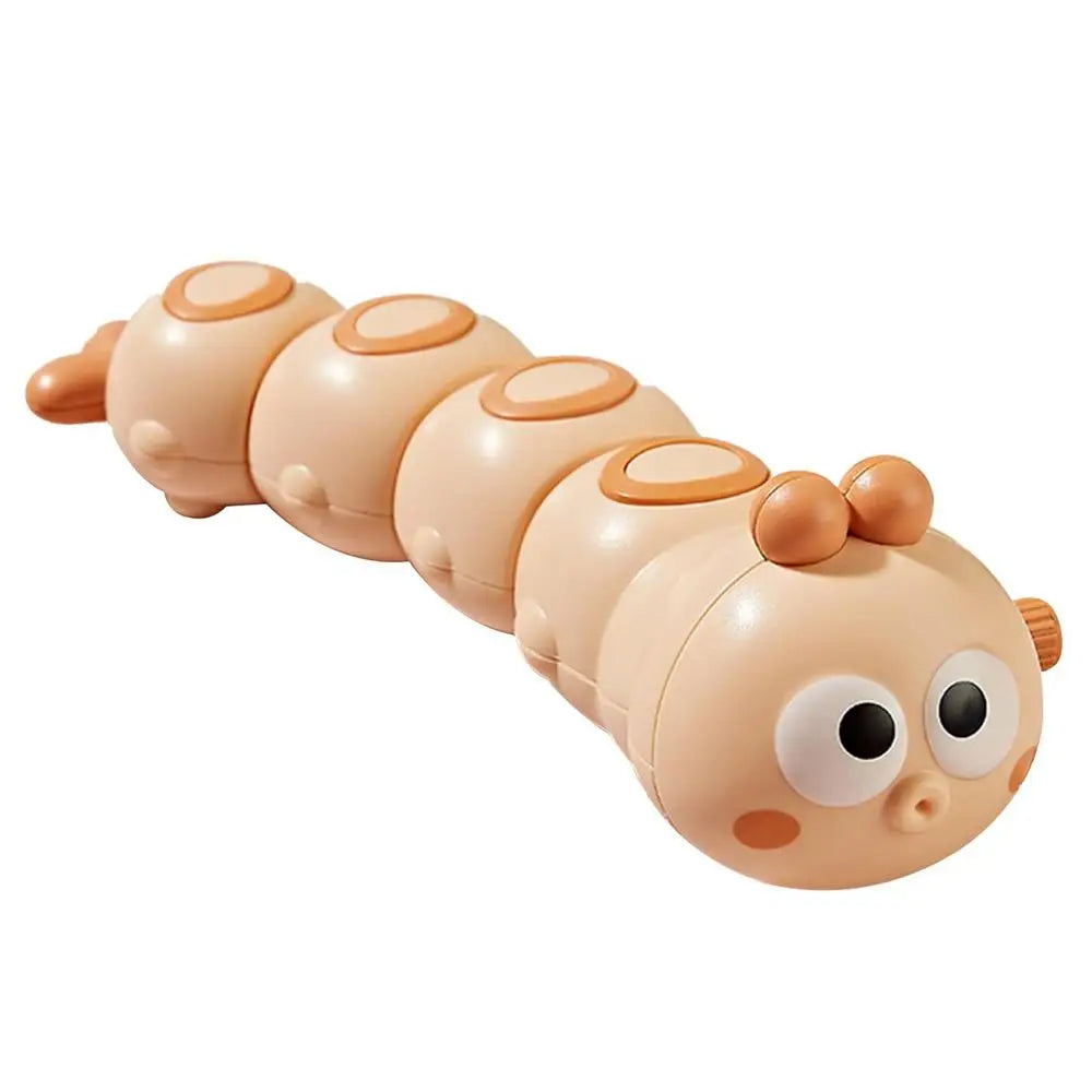 Orange wind-up caterpillar toy with a segmented body and wide-eyed face