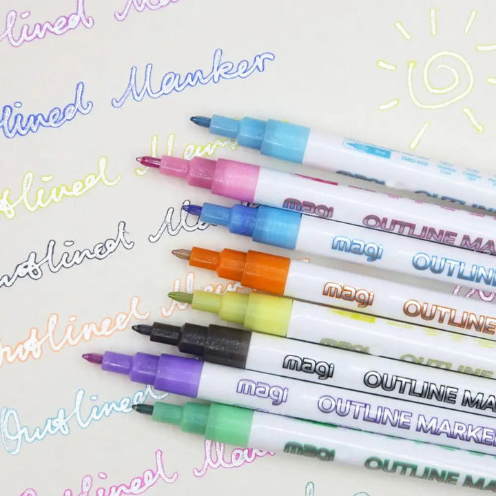 Outline marker lettering samples beside assorted colored markers