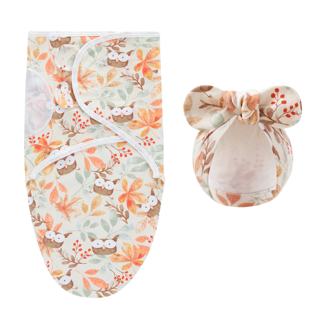 Swaddle blanket and matching bow hat with owls, leaves, and warm-toned flowers