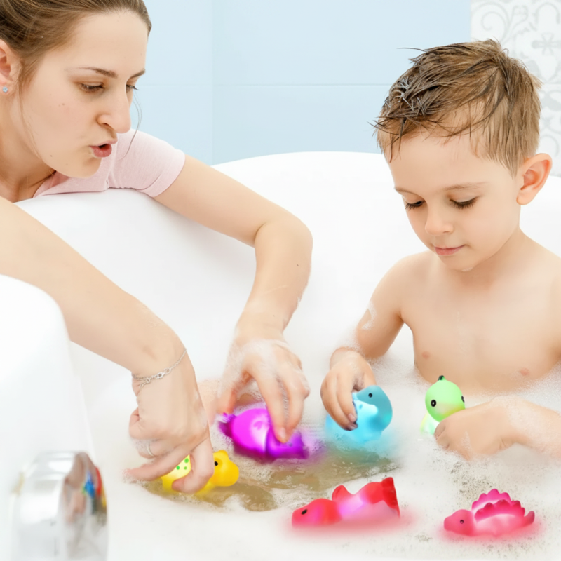 Parent and child playing with colorful light-up dinosaur figures in a bathtub