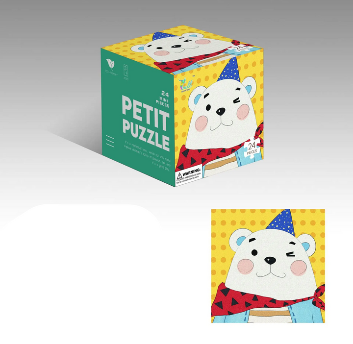 Bear jigsaw puzzle with a blue party hat, yellow background, and matching cube box