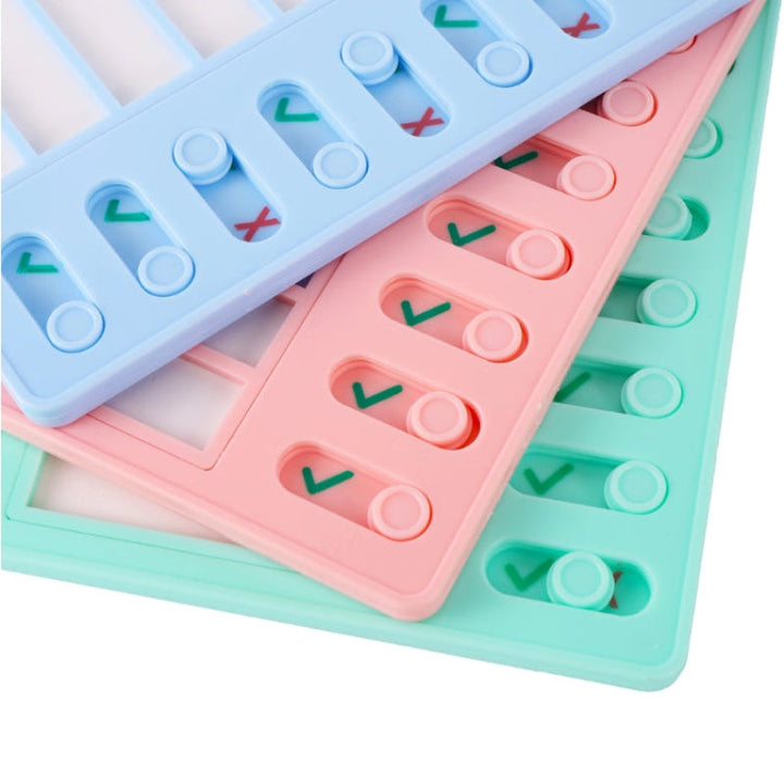 Close-up of blue, pink, and green task boards with sliding checkmark and cross indicators.