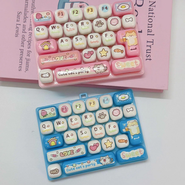 Light pink and light blue fidget keyboards with letters and cat-themed key designs
