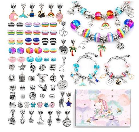 Colorful beads, silver-tone charms, finished bracelets, and a pastel unicorn storage box