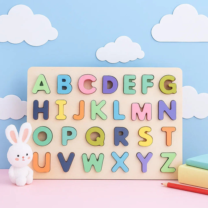 Pastel uppercase alphabet puzzle on a wooden board against a cloud backdrop