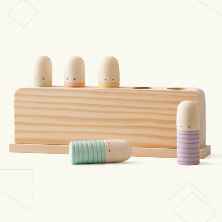 Pastel wooden peg toy with three pegs in the base and two beside it