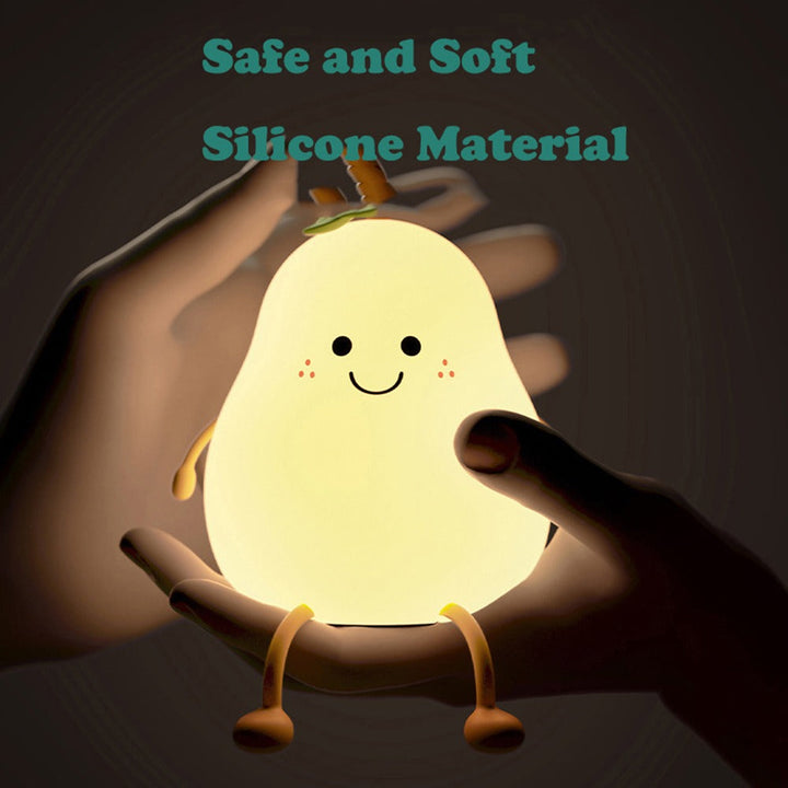 Hands gently squeezing the silicone body of a glowing pear-shaped night light