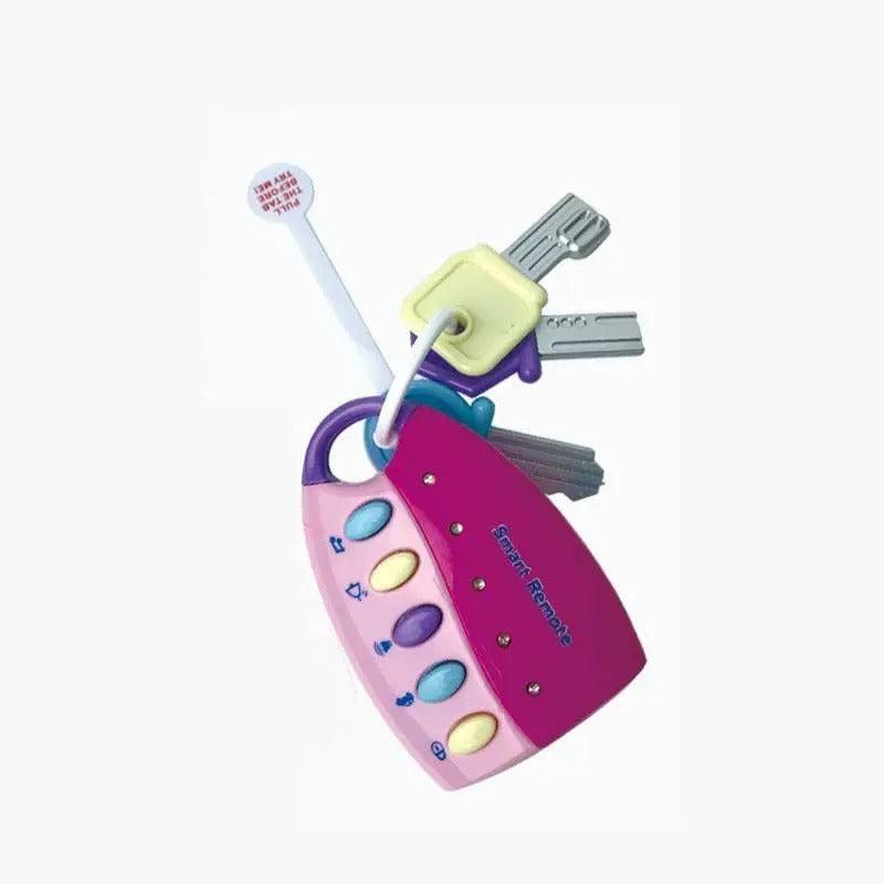 Pink baby key toy with colorful buttons and attached toy keys