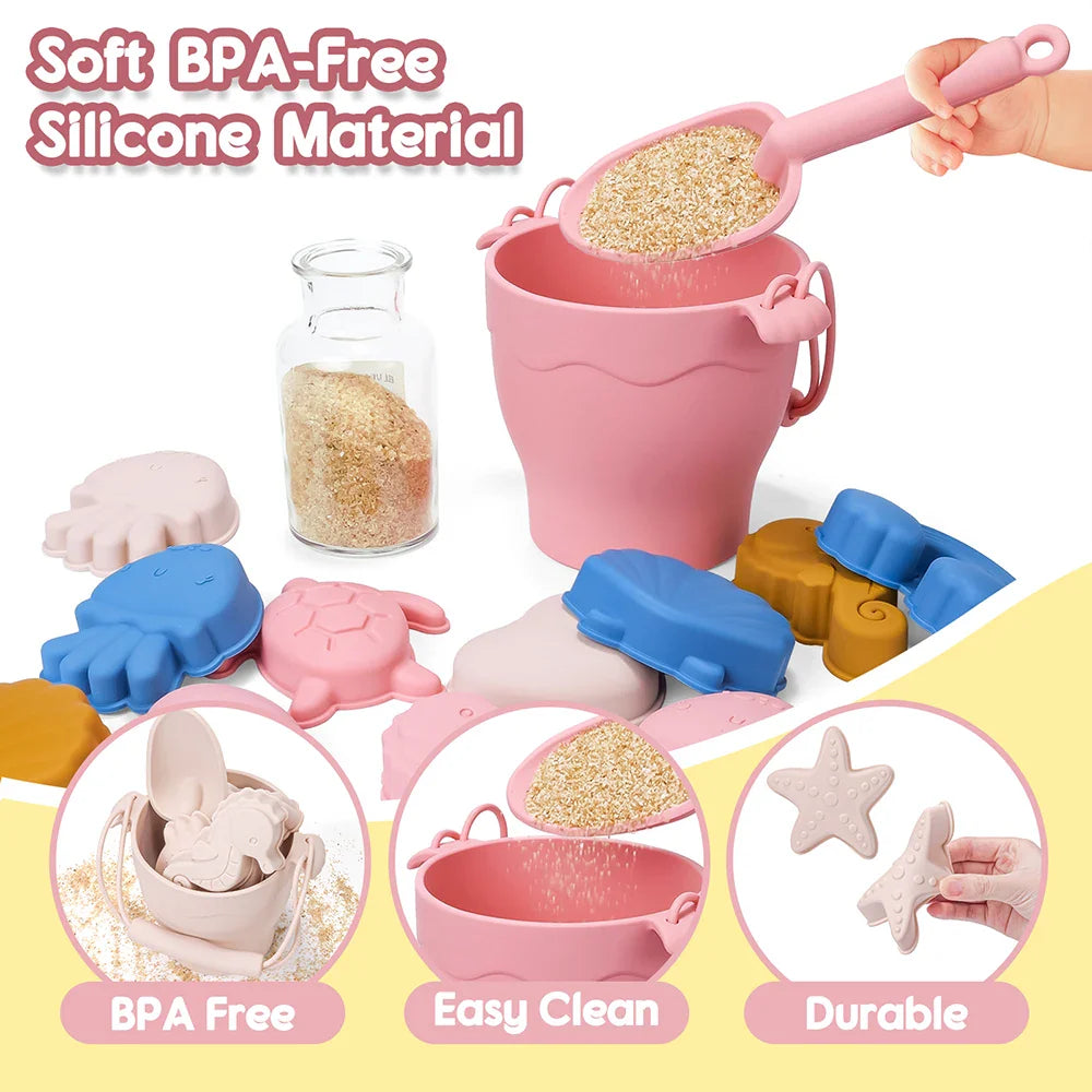 Pink silicone beach bucket and shovel shown with colorful sea-themed sand molds.