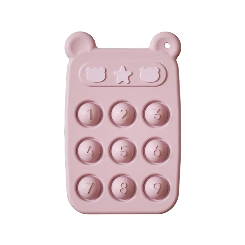 Pink silicone teething phone with nine numbered buttons and bear-ear corners