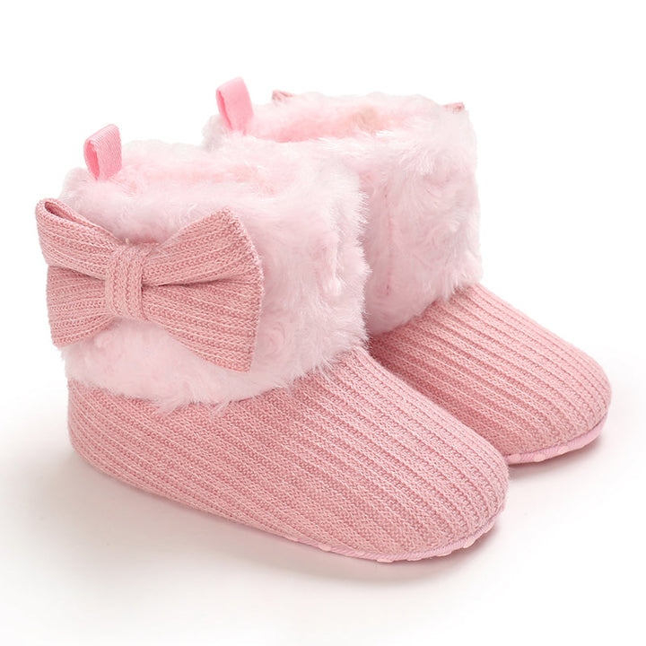 Pink baby winter boots with pale pink plush cuffs and matching bows