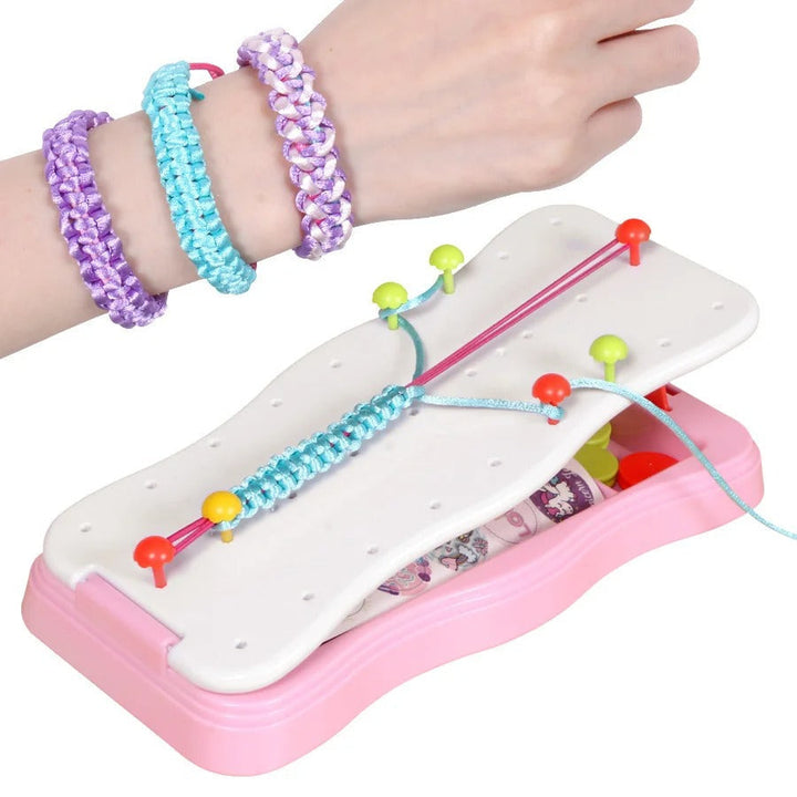 Pink braiding frame holding a turquoise bracelet beside three finished bracelets on a wrist