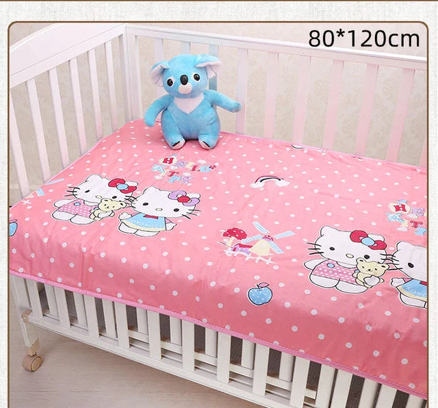 Pink changing mat with cartoon cats and polka dots in a crib, labeled 80 x 120 cm.