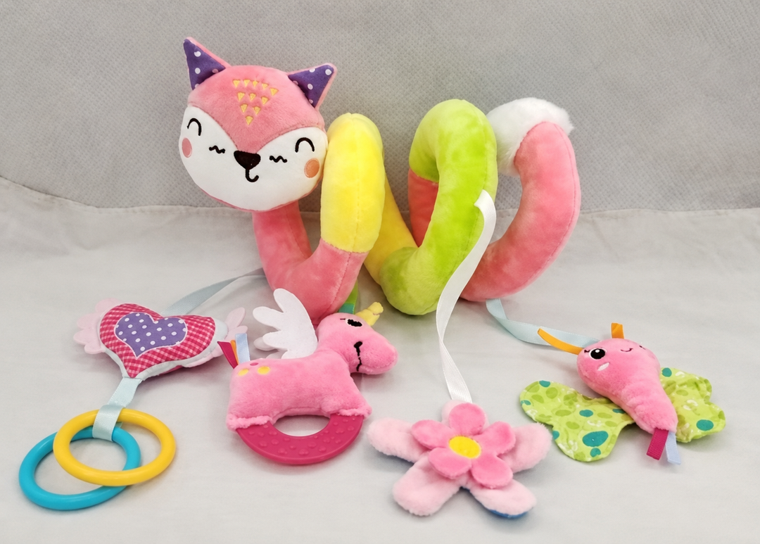 Pink Cat spiral activity toy with hanging rings, plush characters, and a flower