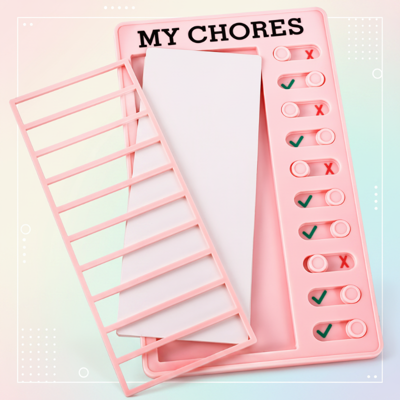 Pink chore chart with its removable grid and replaceable task card shown separately.