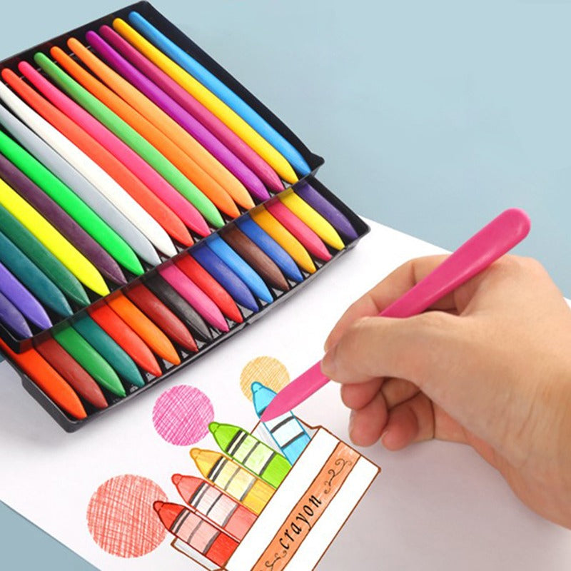 Hand coloring a drawing with a pink crayon beside two trays of colorful crayons